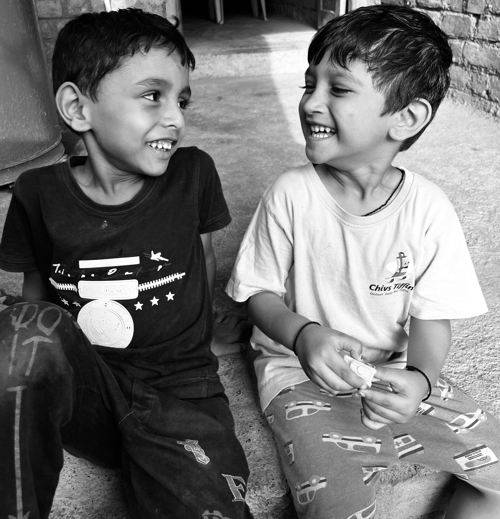 Two children sharing a laugh