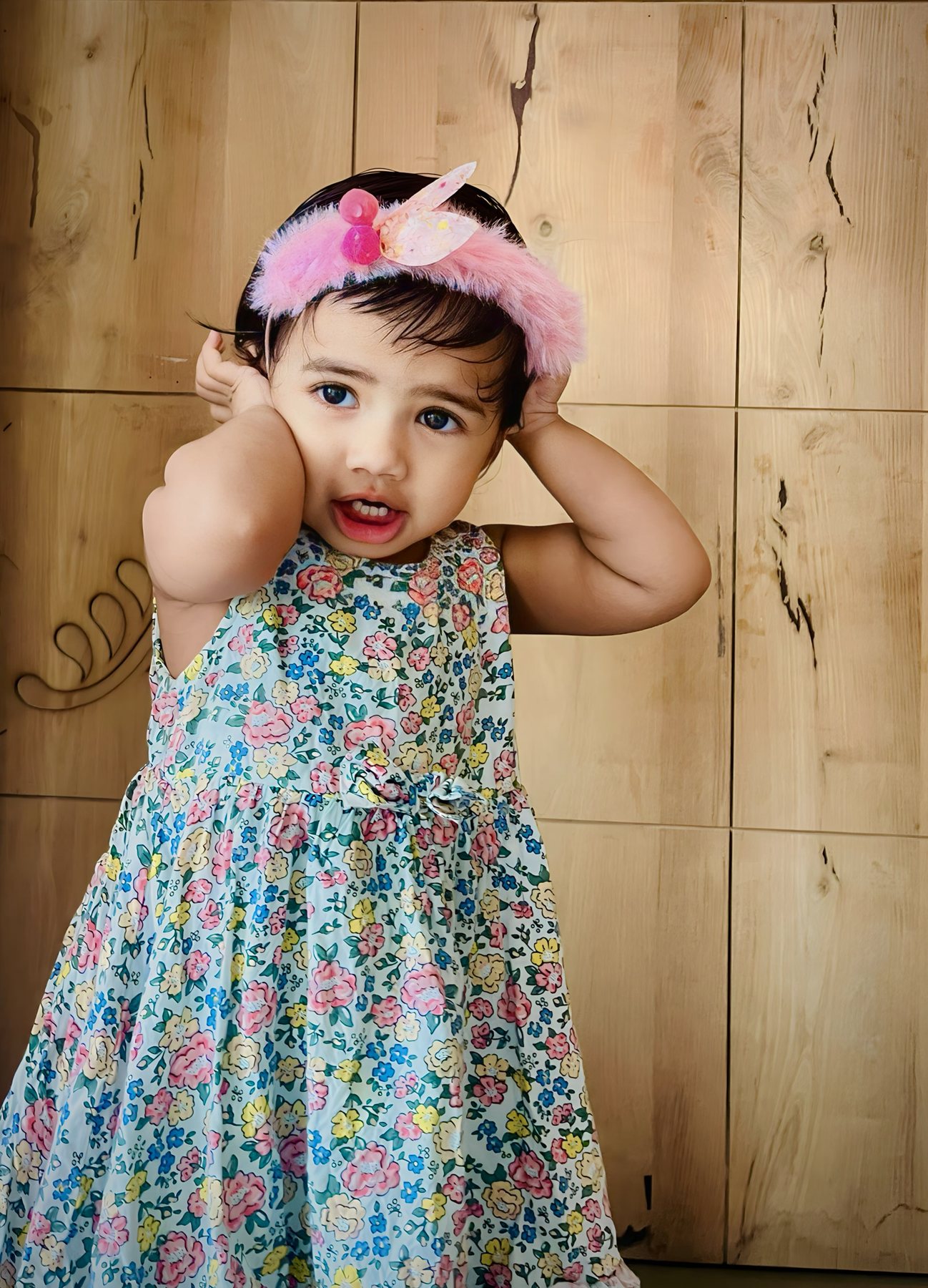 A child in a colorful dress
