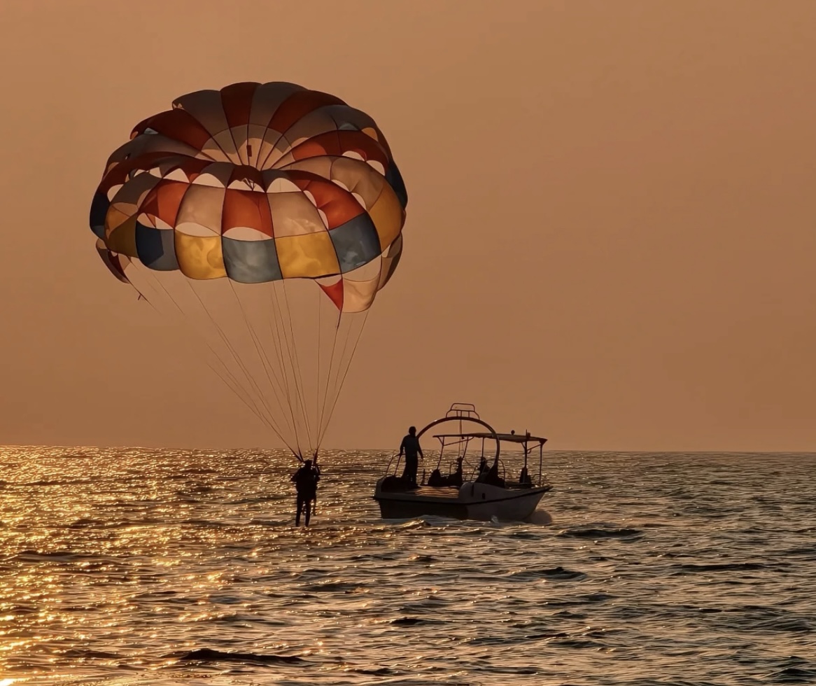 Parasail over the water at sunset