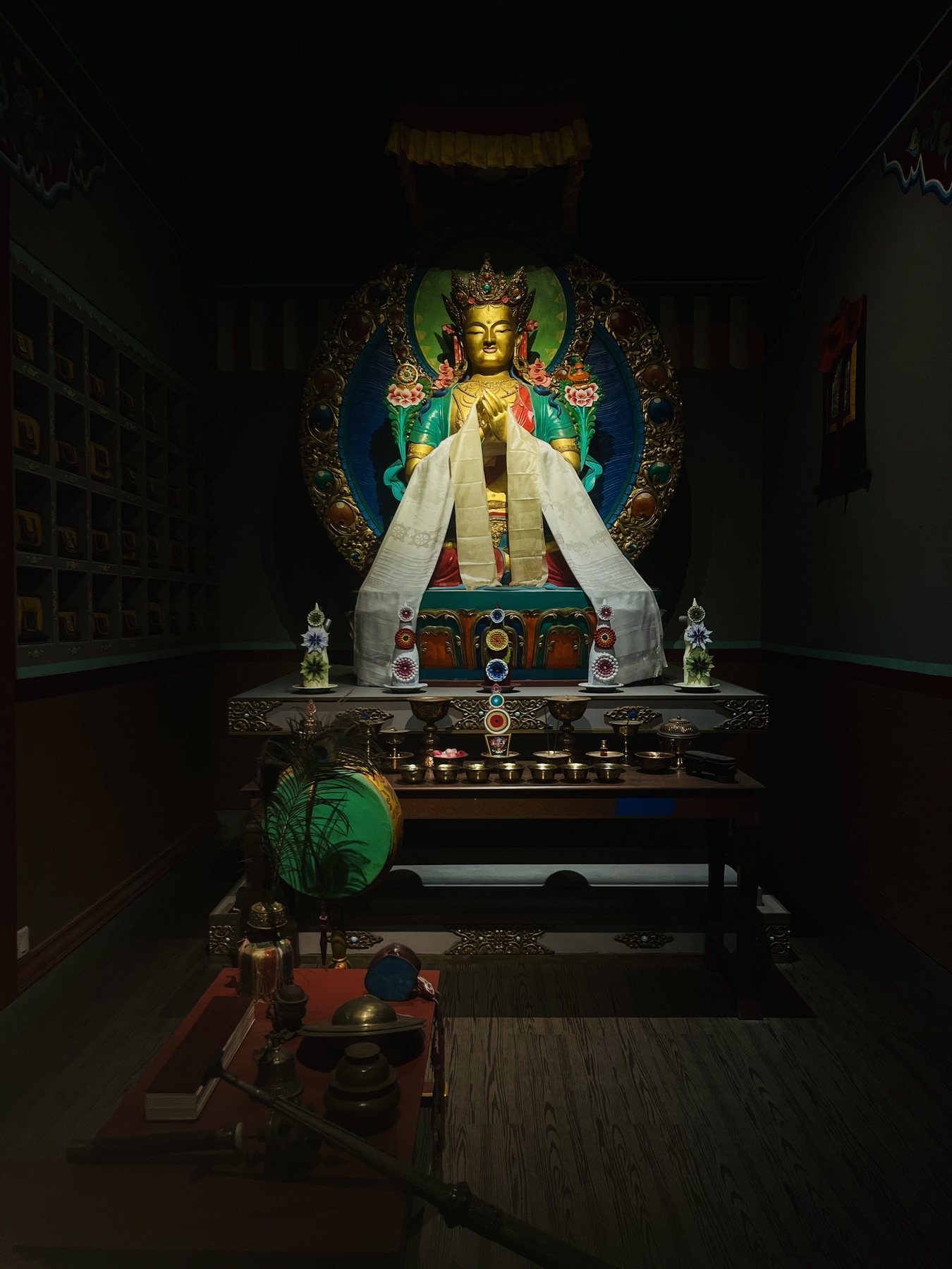 A colorful shrine illuminated in a dark room
